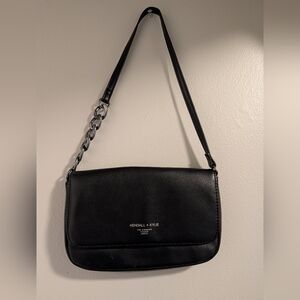 Black faux leather Kendall + Kylie shoulder bag.